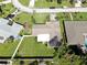 Aerial view of the home's roof and adjacent yards in a residential neighborhood at 8671 11Th N St, St Petersburg, FL 33702