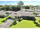 Aerial view of the home showcasing well-maintained landscaping and surrounding neighborhood at 8671 11Th N St, St Petersburg, FL 33702