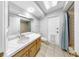 Bathroom featuring a vanity, shower and tub combo at 8671 11Th N St, St Petersburg, FL 33702
