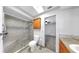 Bathroom with a shower, cabinet and view into the bedroom at 8671 11Th N St, St Petersburg, FL 33702