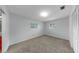 Bedroom with wall-to-wall carpeting and lots of light from the windows at 8671 11Th N St, St Petersburg, FL 33702