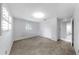 Bedroom featuring a closet with louvered doors and a view into the bathroom at 8671 11Th N St, St Petersburg, FL 33702