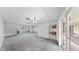 Bright living room featuring shuttered windows and neutral paint, ready for new residents to personalize and enjoy at 8671 11Th N St, St Petersburg, FL 33702
