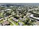 An aerial view of a residential neighborhood, highlighting a community with tree-lined streets at 8671 11Th N St, St Petersburg, FL 33702
