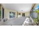 Enclosed patio with ample sunlight, tiled floors, and convenient access to the outdoors at 8671 11Th N St, St Petersburg, FL 33702