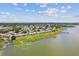 Aerial view of a well-maintained community near a tranquil lake at 9209 Seminole Blvd # 13, Seminole, FL 33772