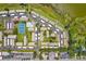 Aerial view showcasing community amenities, including tennis courts and a pool at 9209 Seminole Blvd # 13, Seminole, FL 33772