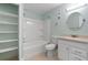 Bathroom featuring a vanity, bathtub, and separate shelving for storage at 9209 Seminole Blvd # 13, Seminole, FL 33772