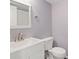Powder room featuring a white vanity with chrome fixtures and a matching framed mirror at 9209 Seminole Blvd # 13, Seminole, FL 33772