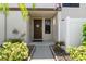 Charming entryway with a decorative door and well-maintained landscaping at 9209 Seminole Blvd # 13, Seminole, FL 33772