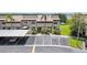 Townhome exterior with parking, carport, and well-maintained landscaping at 9209 Seminole Blvd # 13, Seminole, FL 33772