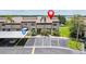 Townhome exterior with parking, carport, and well-maintained landscaping at 9209 Seminole Blvd # 13, Seminole, FL 33772