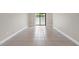 Bright living room featuring neutral paint, tile floors and sliding glass doors at 9209 Seminole Blvd # 13, Seminole, FL 33772