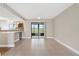 Bright and spacious living area that flows into the kitchen and patio beyond at 9209 Seminole Blvd # 13, Seminole, FL 33772