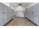 Mailroom with multiple mailboxes, overhead lights, and hardwood-look floor at 9209 Seminole Blvd # 13, Seminole, FL 33772