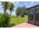 Outdoor patio and manicured lawn offer scenic views of the surrounding lake at 9209 Seminole Blvd # 13, Seminole, FL 33772