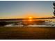 Scenic sunset view over the lake, reflecting a warm glow, showcasing nature's beauty at 9209 Seminole Blvd # 13, Seminole, FL 33772