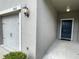 Townhome showing garage and front door with well-maintained, neutral toned exterior at 9768 Pembrooke Pines Dr, Sun City Center, FL 33573