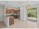 Bright kitchen with stainless steel appliances, granite countertops, and access to the backyard at 9768 Pembrooke Pines Dr, Sun City Center, FL 33573