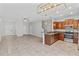 Open-concept kitchen boasts stainless steel appliances and granite countertops perfect for modern living at 9768 Pembrooke Pines Dr, Sun City Center, FL 33573
