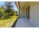 Covered patio with concrete flooring and sliding glass doors at 9768 Pembrooke Pines Dr, Sun City Center, FL 33573