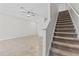 Cozy staircase next to the living area that adds warmth and character to the space at 9768 Pembrooke Pines Dr, Sun City Center, FL 33573