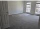 Spacious bedroom with neutral carpeting and large windows providing natural light at 9958 Ashburn Lake Dr, Tampa, FL 33610