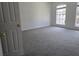 Spacious bedroom with neutral carpeting and large windows providing natural light at 9958 Ashburn Lake Dr, Tampa, FL 33610