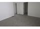 Bright bedroom has closet and bathroom access, and neutral colored carpet at 9958 Ashburn Lake Dr, Tampa, FL 33610