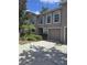 Charming townhouse with attached garage and landscaped front yard at 9958 Ashburn Lake Dr, Tampa, FL 33610