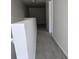 Hallway upstairs with new carpet and white paint leading to other rooms in the house at 9958 Ashburn Lake Dr, Tampa, FL 33610
