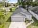 Overhead view of home showing the driveway, roof, landscaping, and surrounding neighborhood at 1004 Osage St, Clearwater, FL 33755