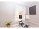 Modern bar area features white chairs, decorative lighting, and hardwood floors at 1004 Osage St, Clearwater, FL 33755