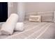 Cozy bedroom featuring a comfortable bed with decorative pillows and soft, neutral bedding at 1004 Osage St, Clearwater, FL 33755