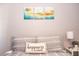 Bedroom showcasing a comfortable bed with decorative pillows and framed art above the headboard at 1004 Osage St, Clearwater, FL 33755