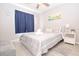 Bright bedroom with coordinated decor, featuring a comfortable bed and soft gray accents at 1004 Osage St, Clearwater, FL 33755