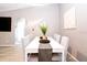 Dining room showcases white table, striped chairs, and modern finishes at 1004 Osage St, Clearwater, FL 33755