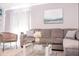 Cozy living room featuring a sectional sofa, modern furniture, and a neutral color scheme at 1004 Osage St, Clearwater, FL 33755
