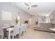 Open concept living space with vaulted ceiling, ceiling fans, and modern furnishings at 1004 Osage St, Clearwater, FL 33755