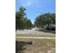 View of a residential street with mature trees offering shade and curb appeal at 1004 Osage St, Clearwater, FL 33755
