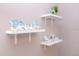 Charming wall decor with floating shelves adorned with beach-themed decorations at 1004 Osage St, Clearwater, FL 33755