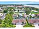 Aerial view of the homes in the community, featuring a community pool at 10597 Alvarado Ct, Seminole, FL 33772