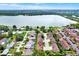 Breathtaking lake view and community, boasting well-maintained homes, lush landscapes, and serene waterfront living at 10597 Alvarado Ct, Seminole, FL 33772