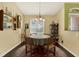 Cozy dining room with hardwood floors, natural light, and charming decor at 10597 Alvarado Ct, Seminole, FL 33772