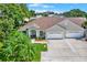Beautiful home featuring a well-manicured lawn, a two-car garage, and inviting curb appeal in a desirable neighborhood at 10597 Alvarado Ct, Seminole, FL 33772