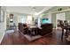 Comfortable living room featuring hardwood floors, lots of clocks, and a ceiling fan at 10597 Alvarado Ct, Seminole, FL 33772