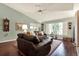 Spacious living room with hardwood floors, natural light, and stylish furniture at 10597 Alvarado Ct, Seminole, FL 33772