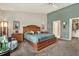 Spacious main bedroom featuring carpet, natural light, and ample closet space at 10597 Alvarado Ct, Seminole, FL 33772
