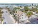 Aerial view of a two-story home with tropical landscaping and neighborhood views at 108 5Th Ave, St Pete Beach, FL 33706