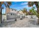 A fenced backyard offers a private deck and access to the garage and additional apartment at 108 5Th Ave, St Pete Beach, FL 33706